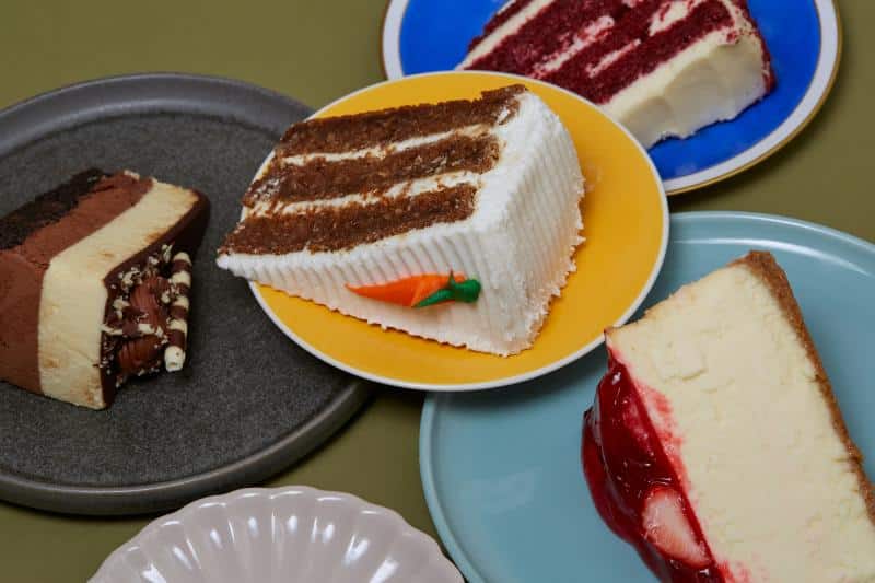 various types of cake on different plates