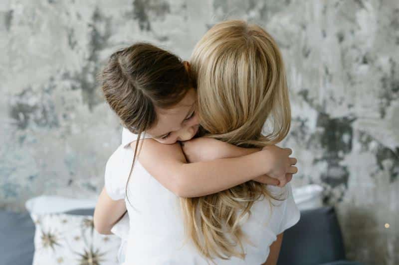mother and daughter hugging