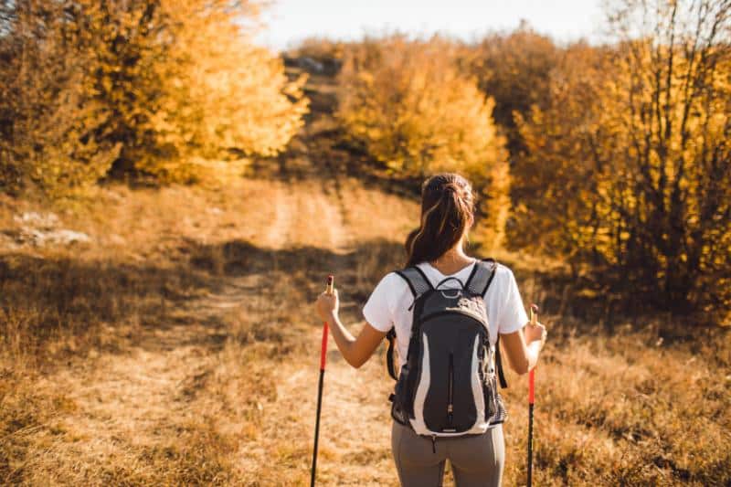 woman hiking to relieve stress