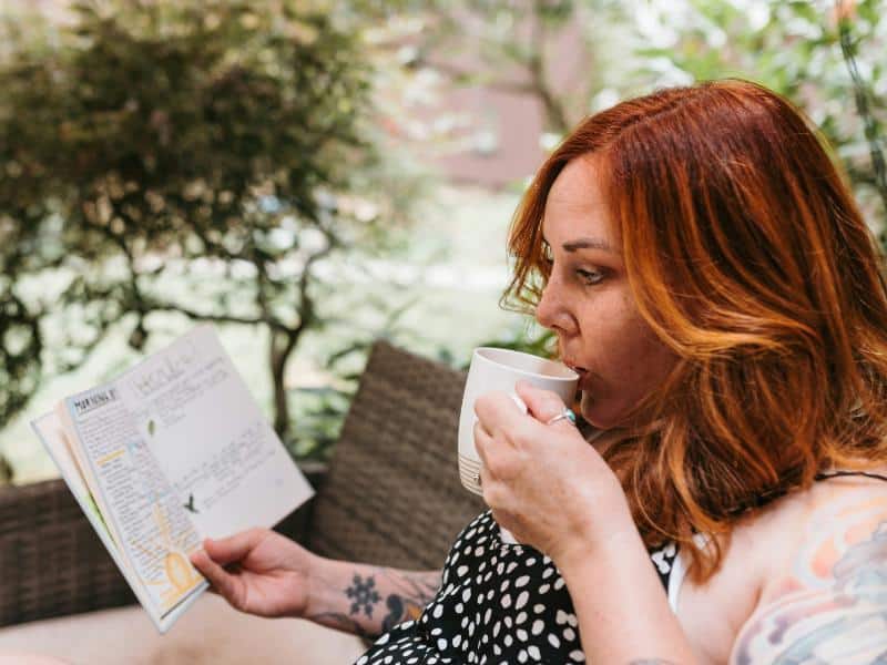 woman looking at her journal