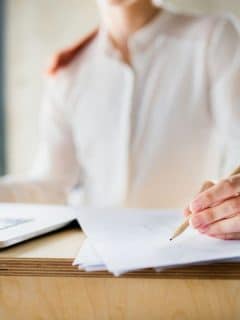 businesswoman signing a document