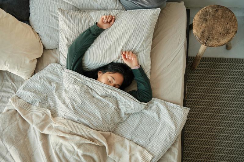woman sleeping in comfy bed