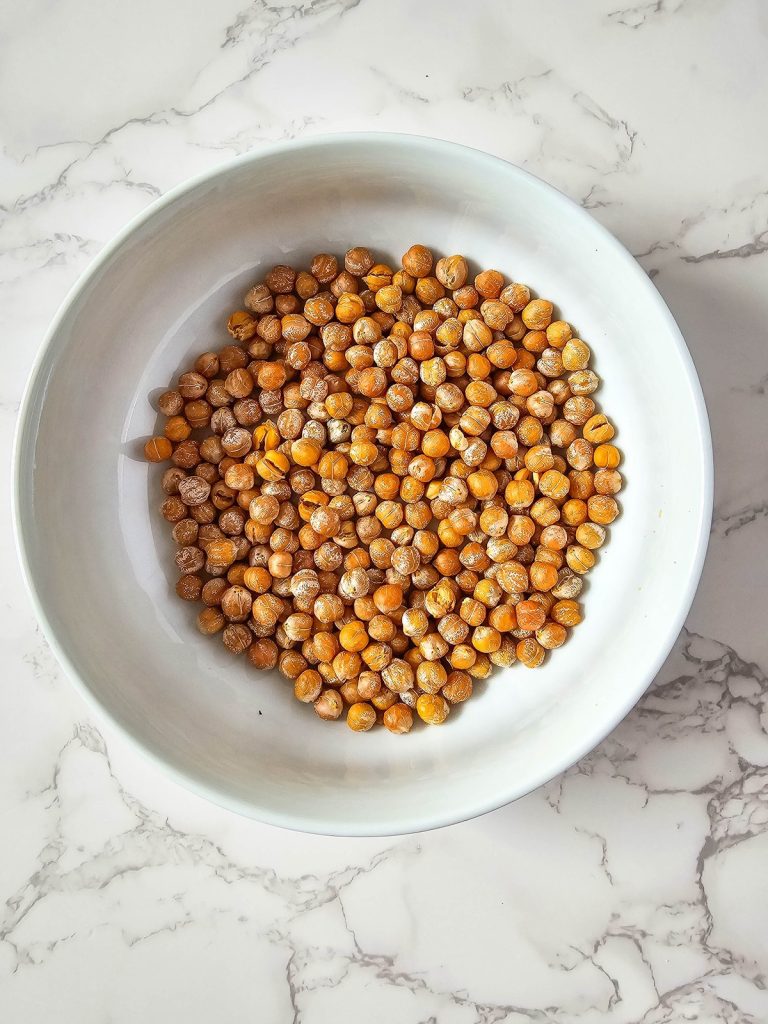 roasted chickpeas in bowl to dry