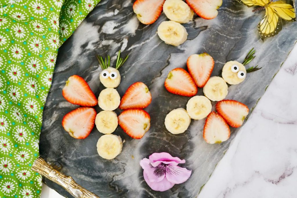 finished butterfly fruit snacks on black marble background