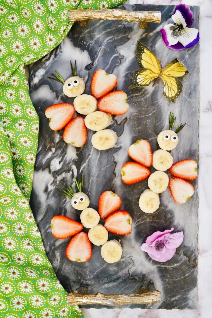 fruit butterfly snacks on marble cutting board