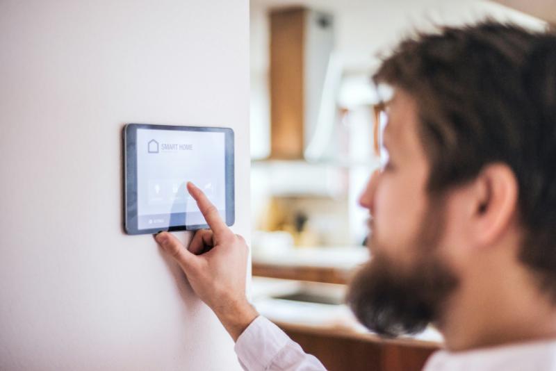 man activating smart home system