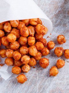 roasted chickpeas spilling out of parchment paper cone