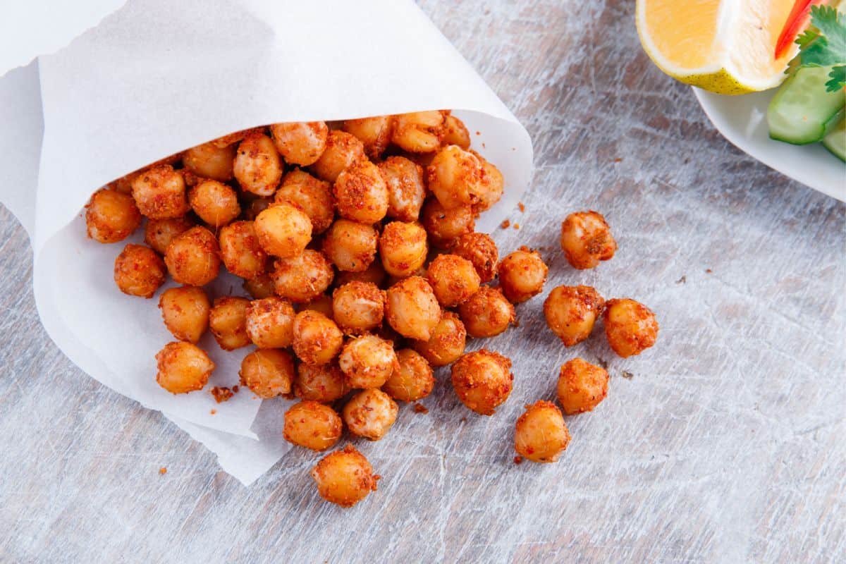 roasted chickpeas spilling out of parchment paper cone