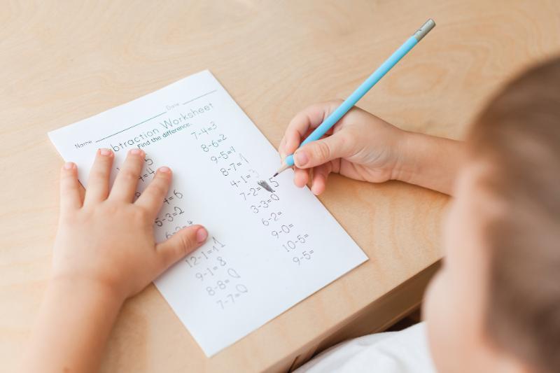 boy working on subtraction problems