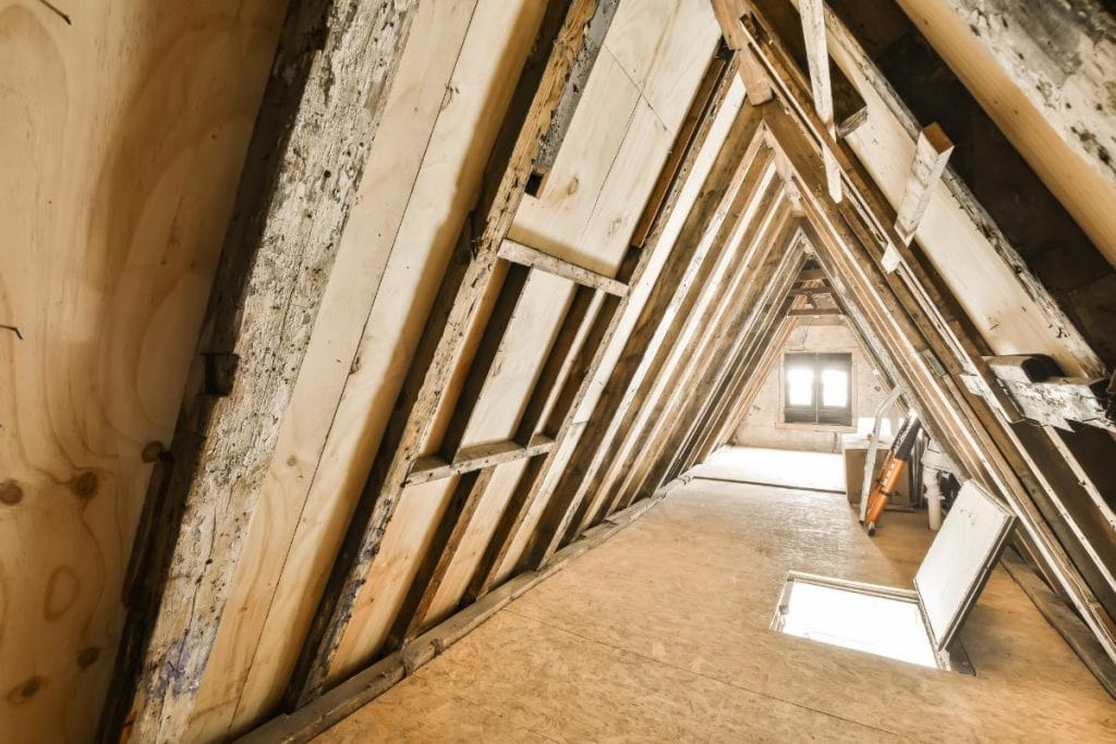 bare attic that has been stripped of insulation etc