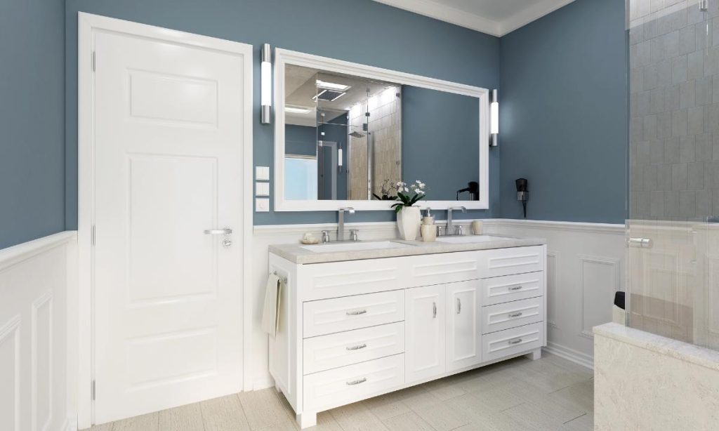 bathroom with blue walls and white trim and accessories