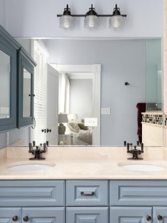 bathroom with pretty blue cabinets