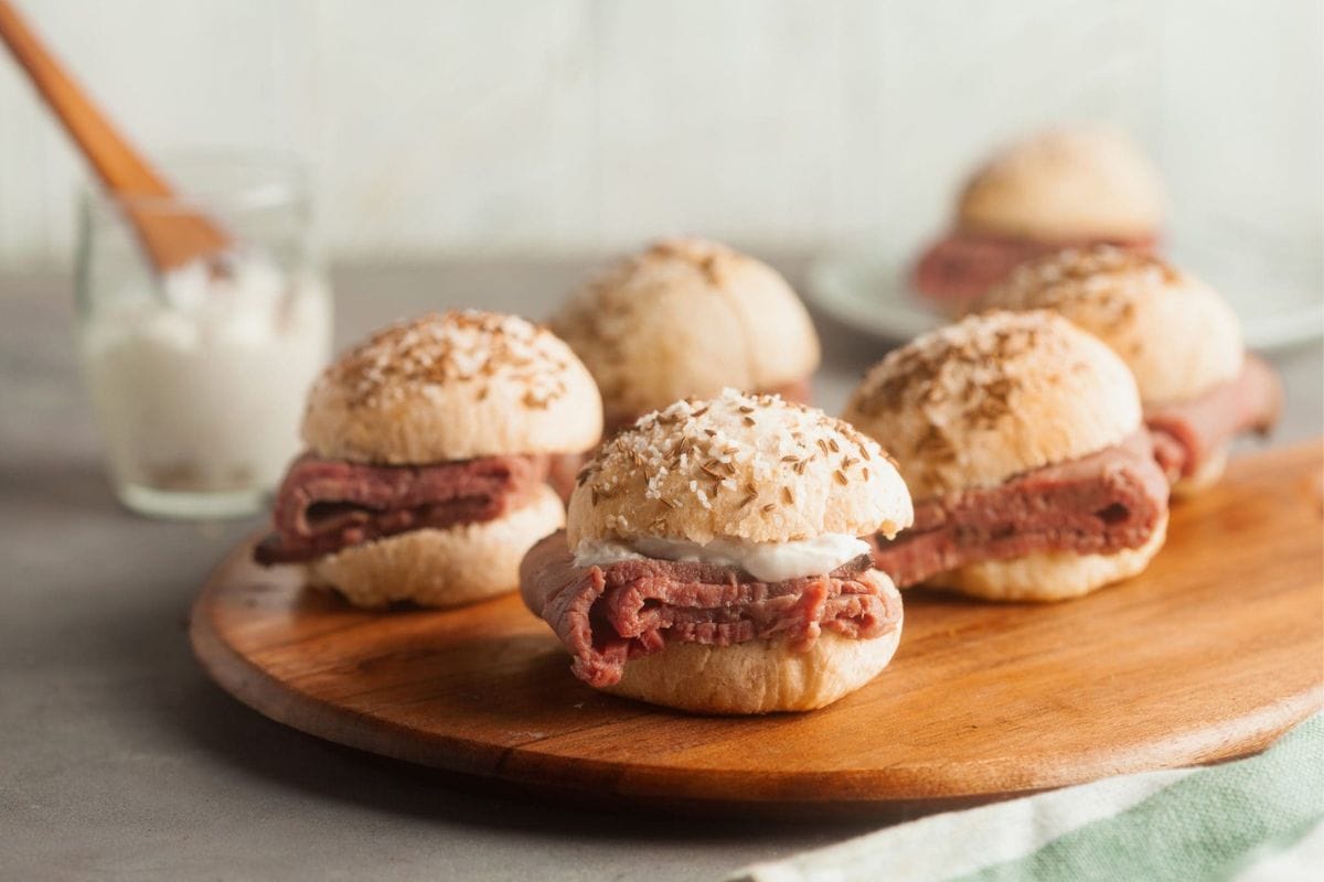 beef on weck sliders on wood cutting board