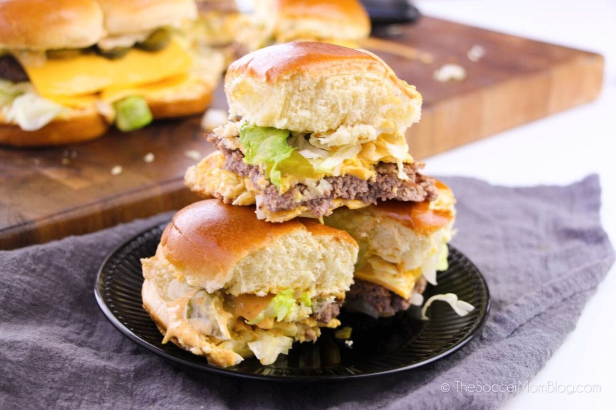 big mac sliders stacked on black plate