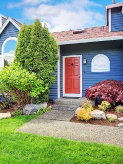 blue house with red door and white trim