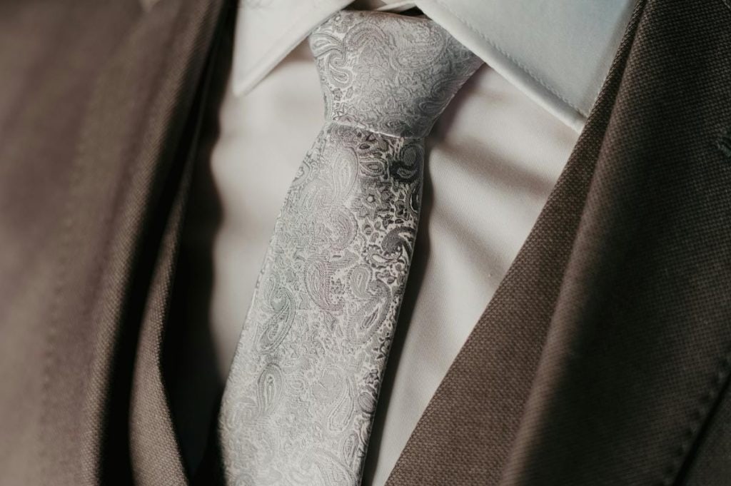 paisley tie with neutral suit