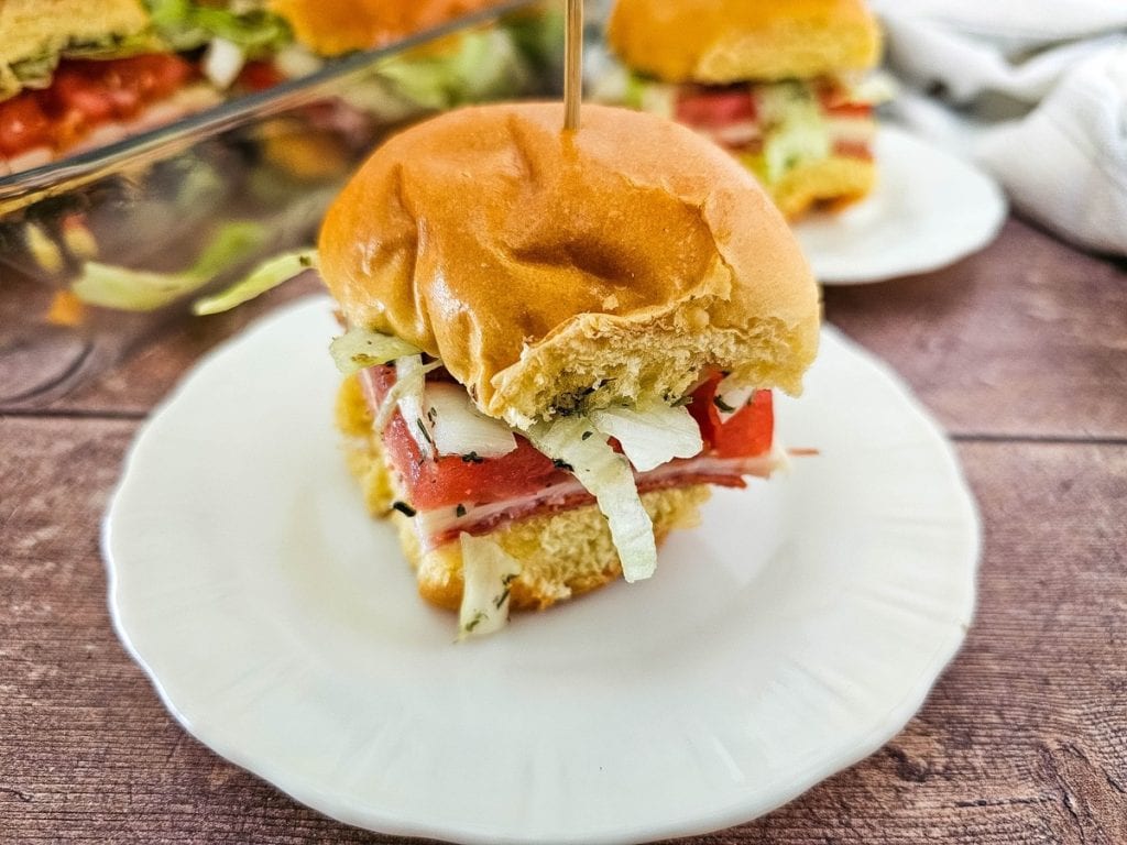 Italian hoagie slider on white plate close up