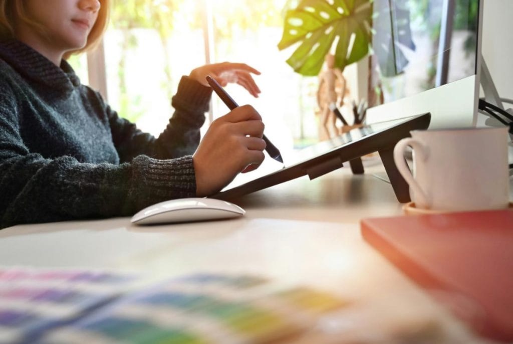 woman designing on a tablet