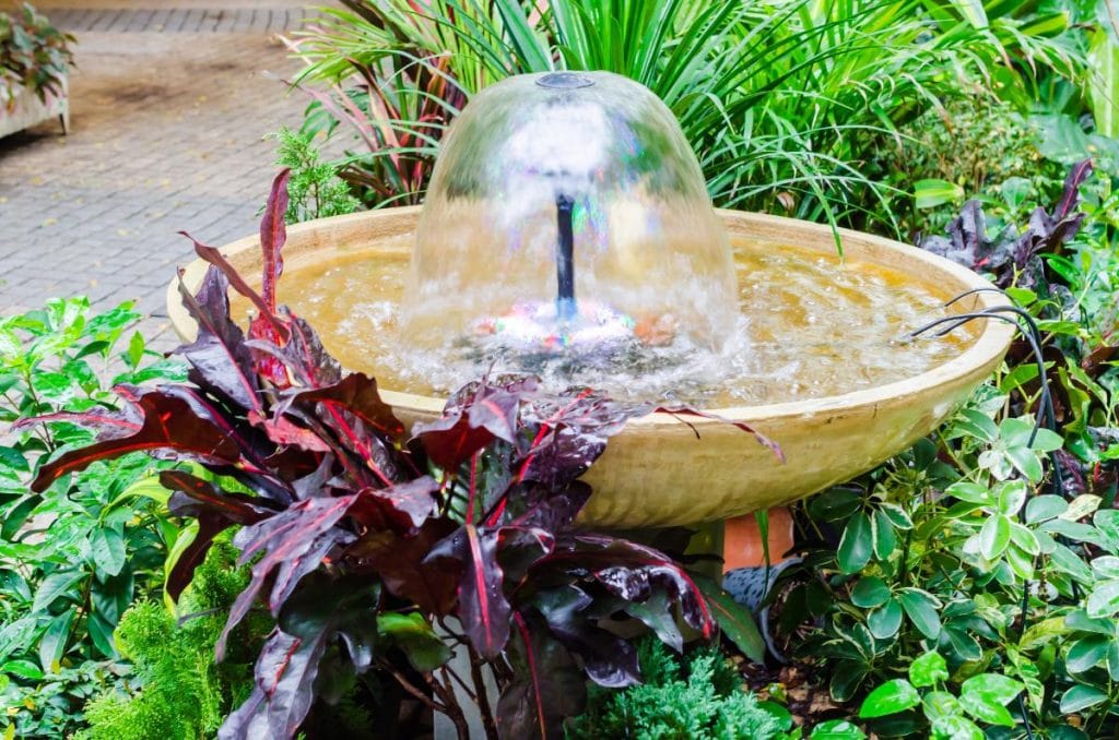 small outdoor fountain in garden