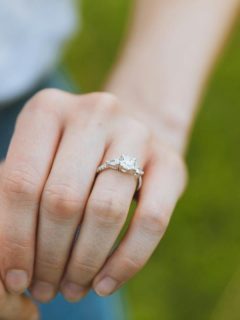 up close hand with engagement ring