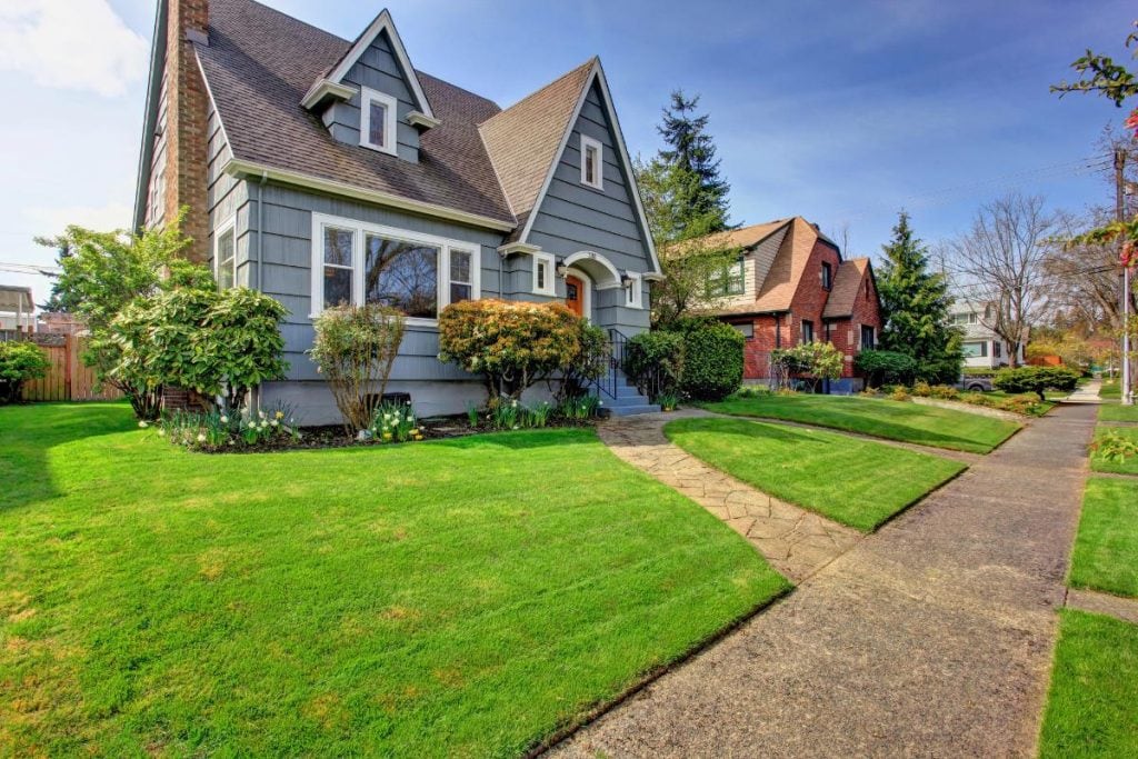 gray house with cute walkway and great curb appeal