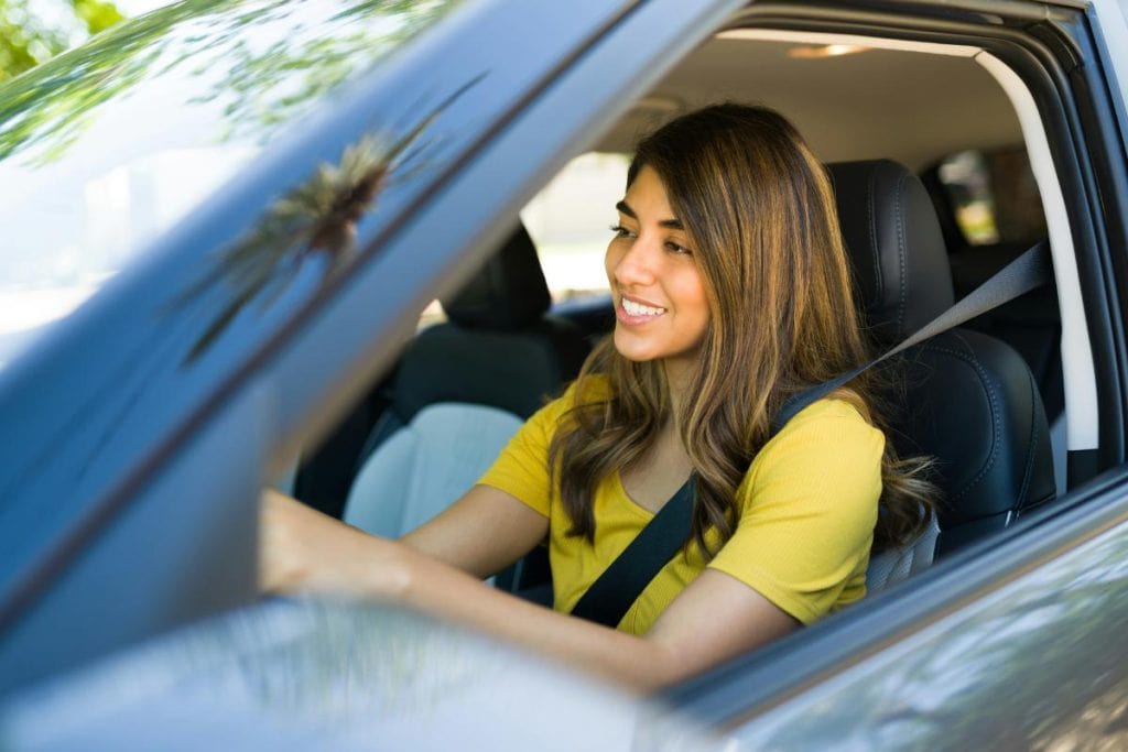 woman driving a car - ride share gigs can be a great earning opportunity for moms