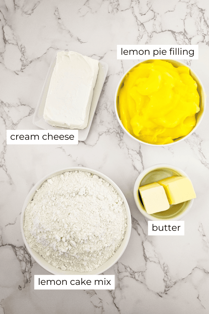 ingredients for lemon dump cake recipe on marble background