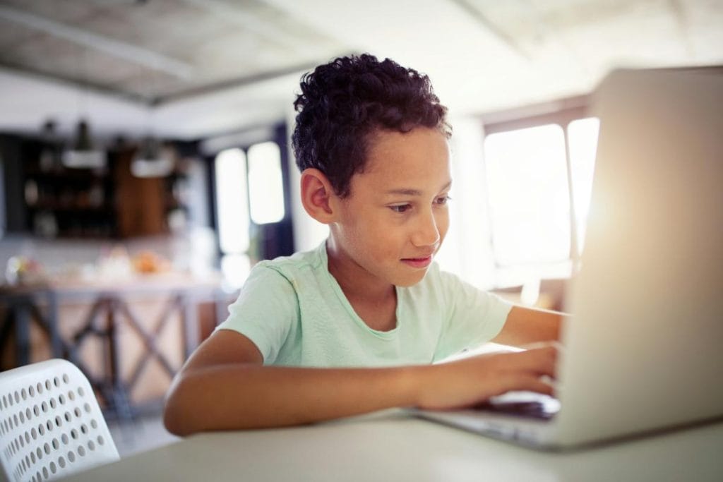 young boy using a laptop