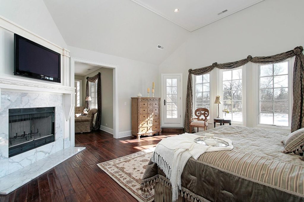 nice master bedroom with a fireplace