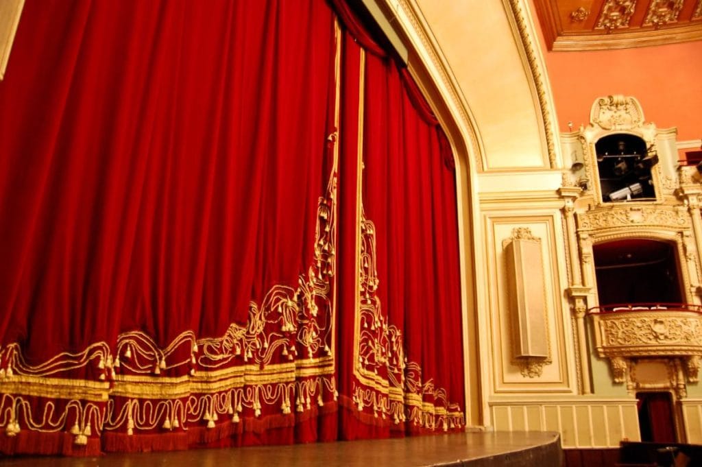 opera stage with huge red curtains