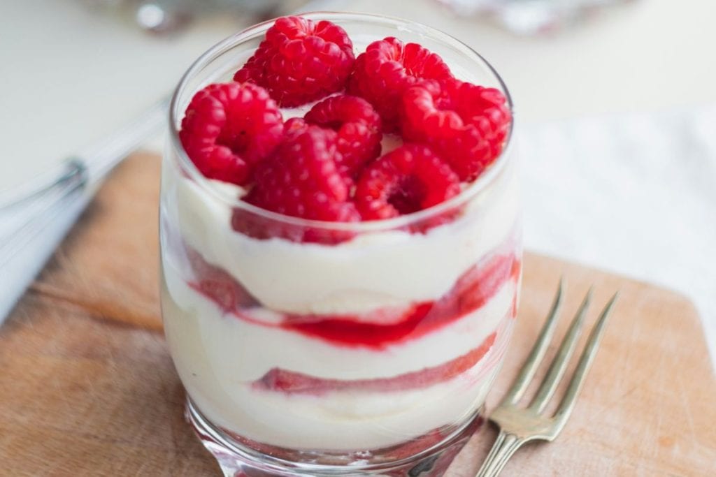 raspberries and yogurt in a glass