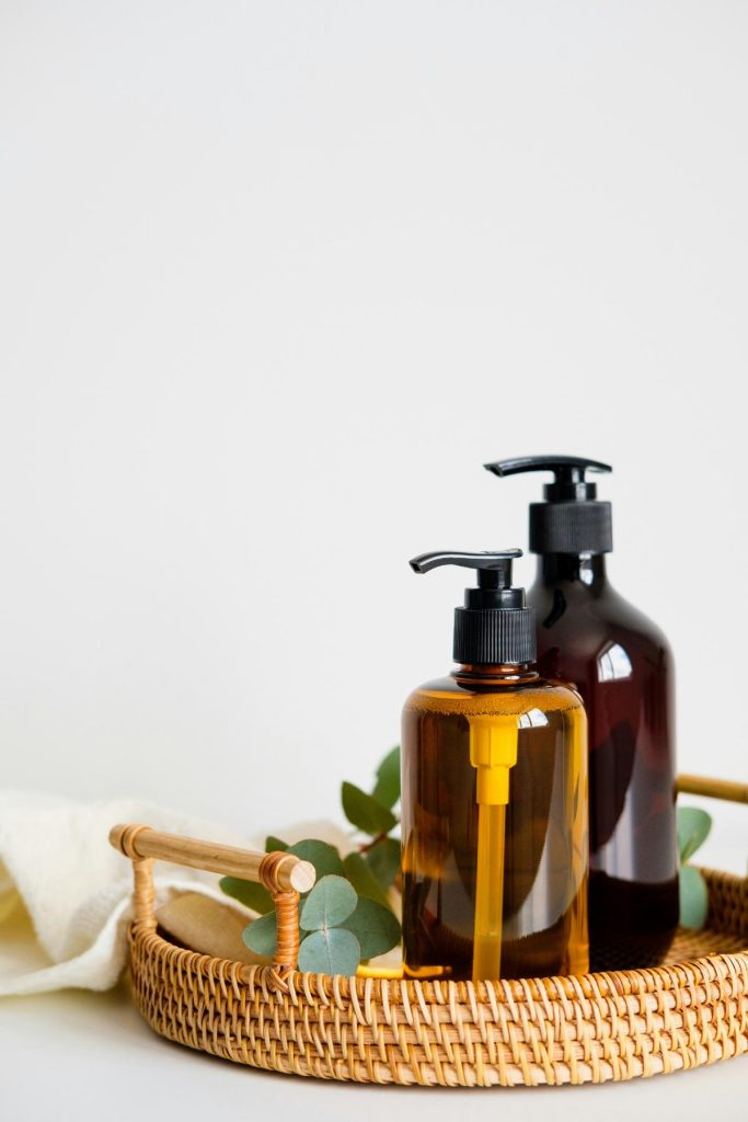 soap dispensers in wood basket tray