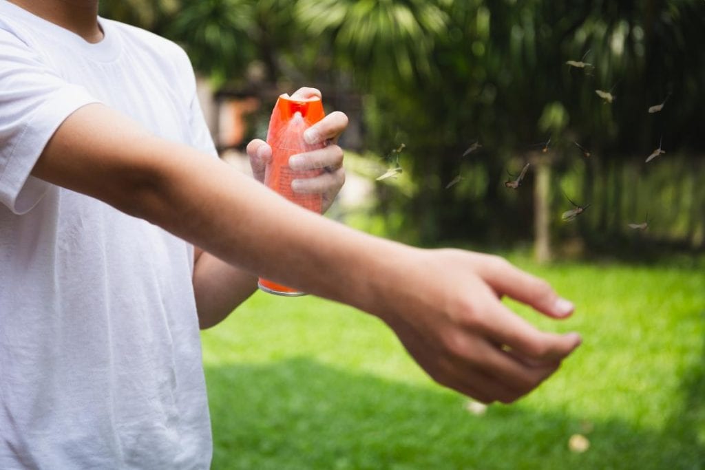 using insect repellent to keep mosquitoes away