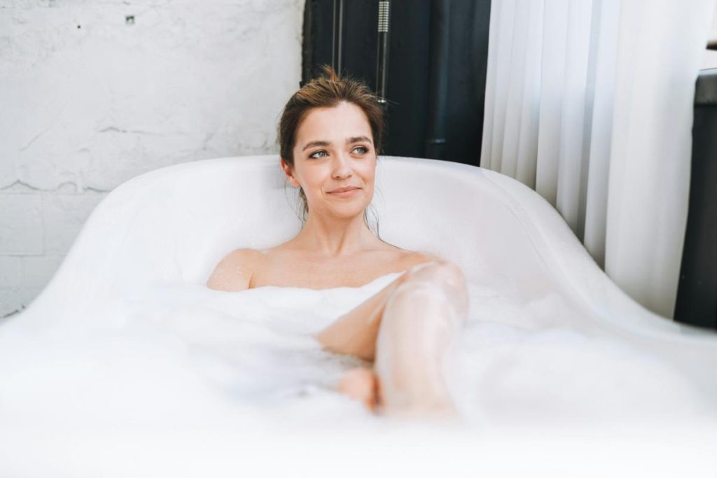 woman taking a bubble bath