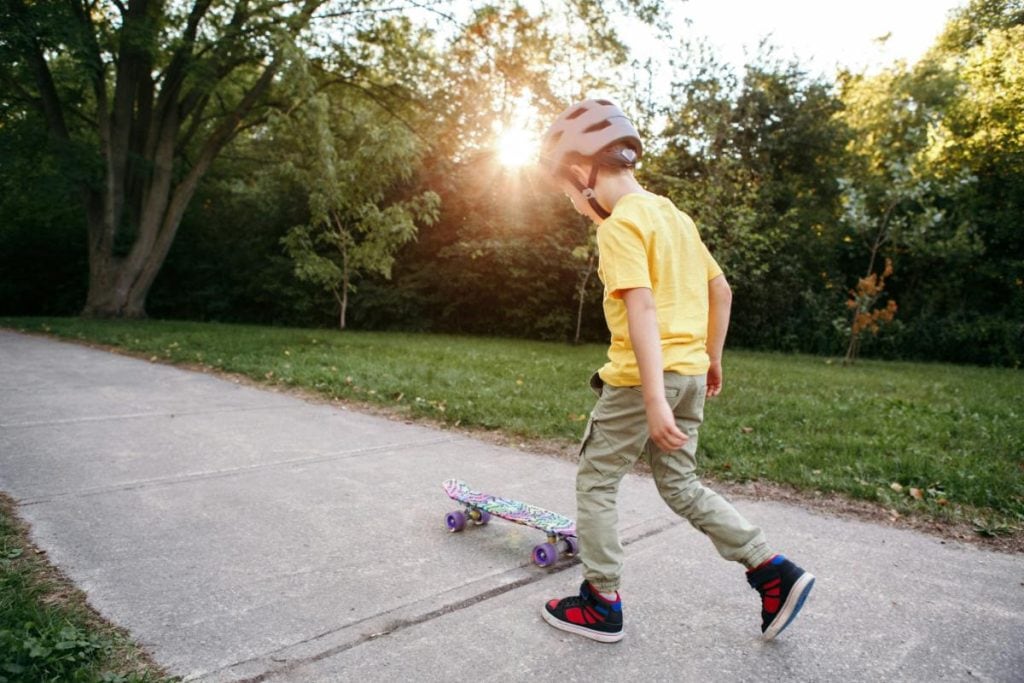 boy with helmet and skateboard