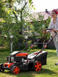 woman using a large lawn mower
