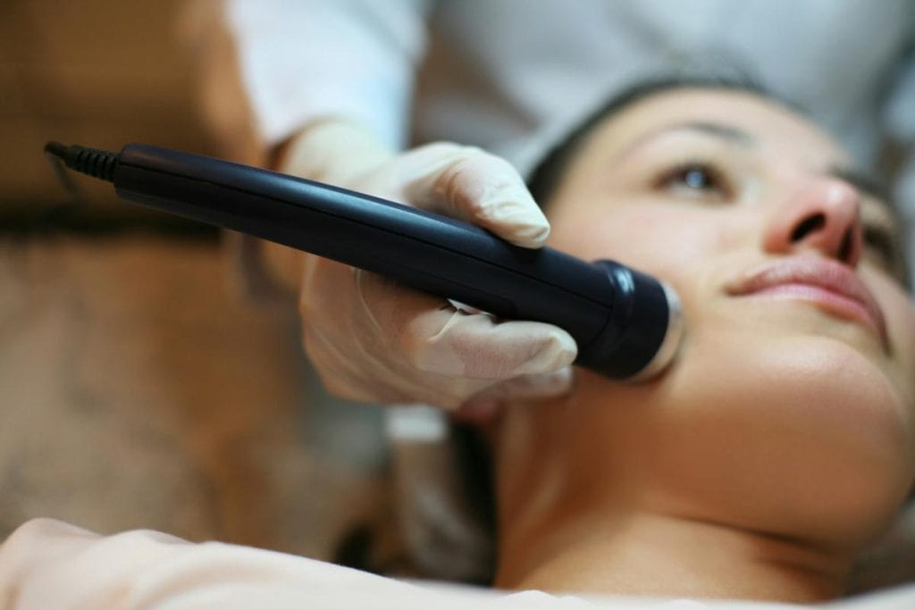 woman getting facial treatment