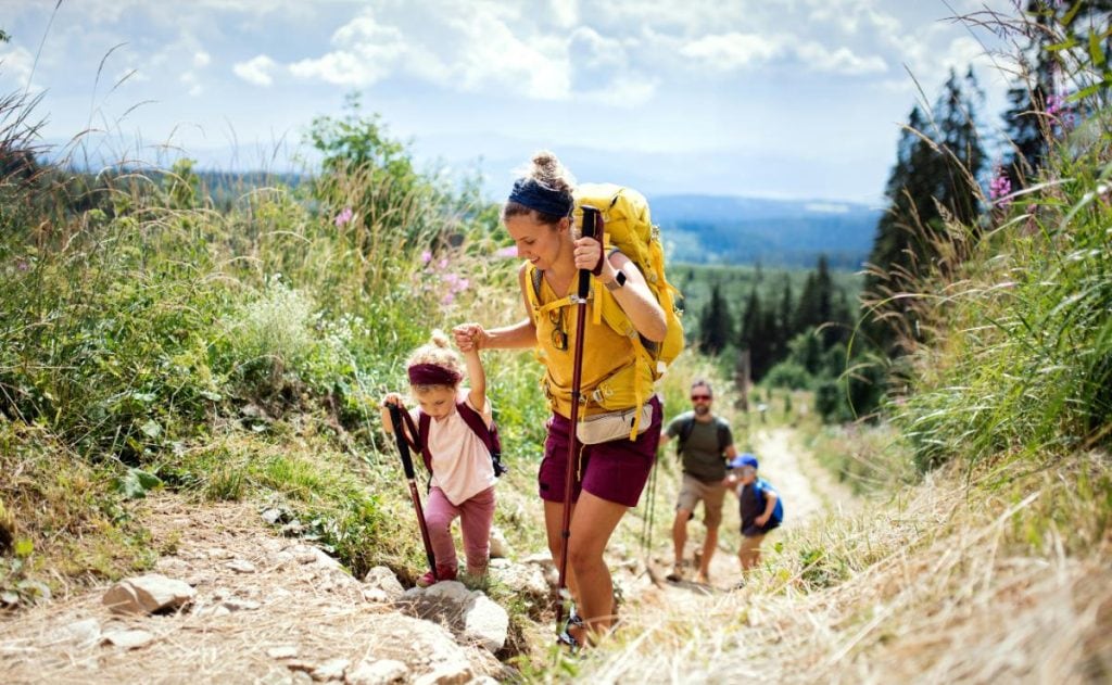 woman hiking with children and husband