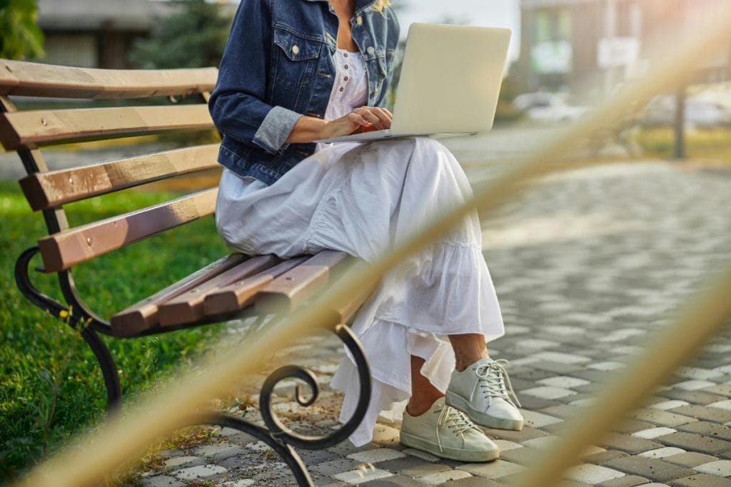 woman outdoors using laptop