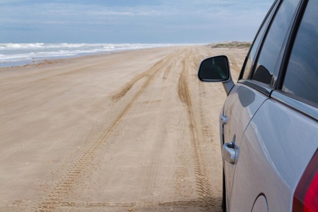 car driving on a beach in Texas