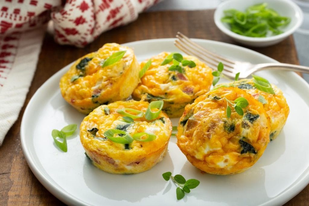 low carb egg muffins made with eggs, spinach, and bacon