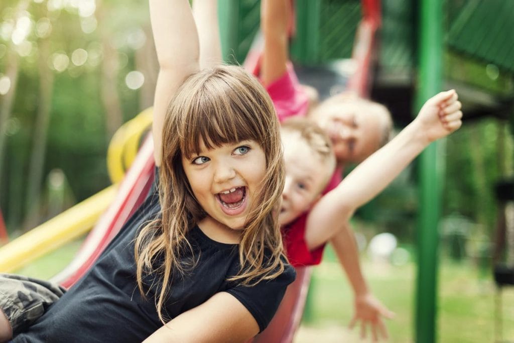 happy kids on a slide