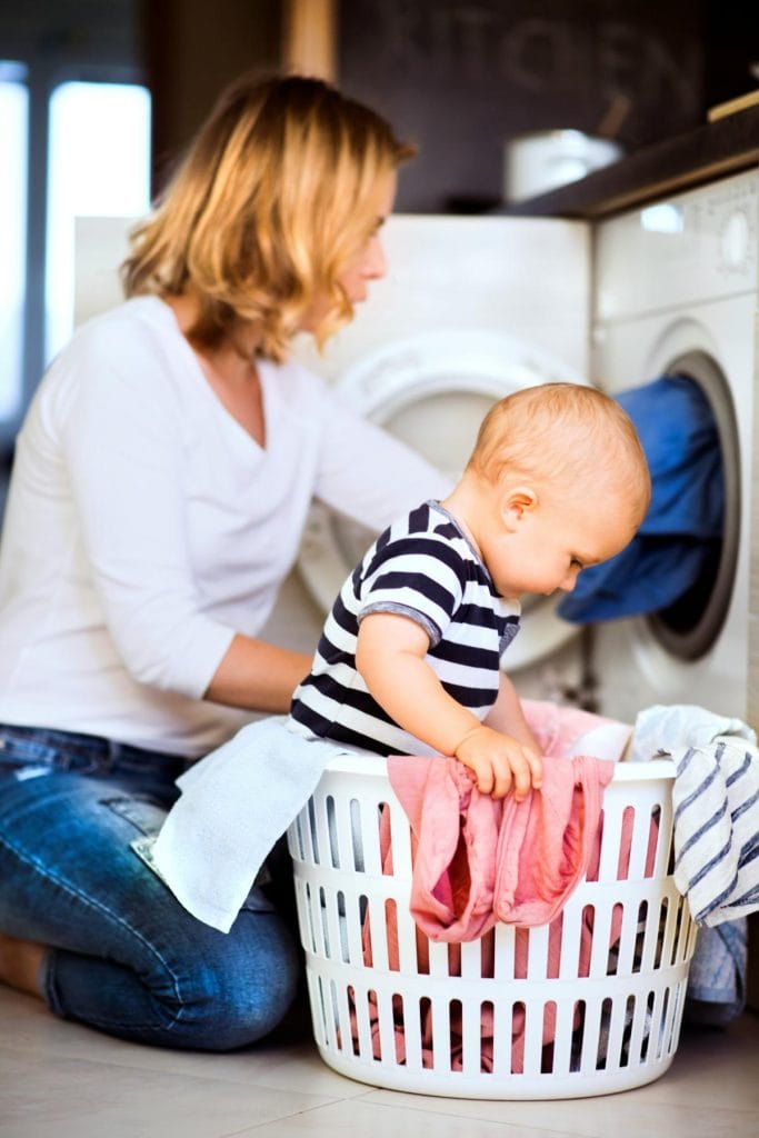 mother and baby doing laundry