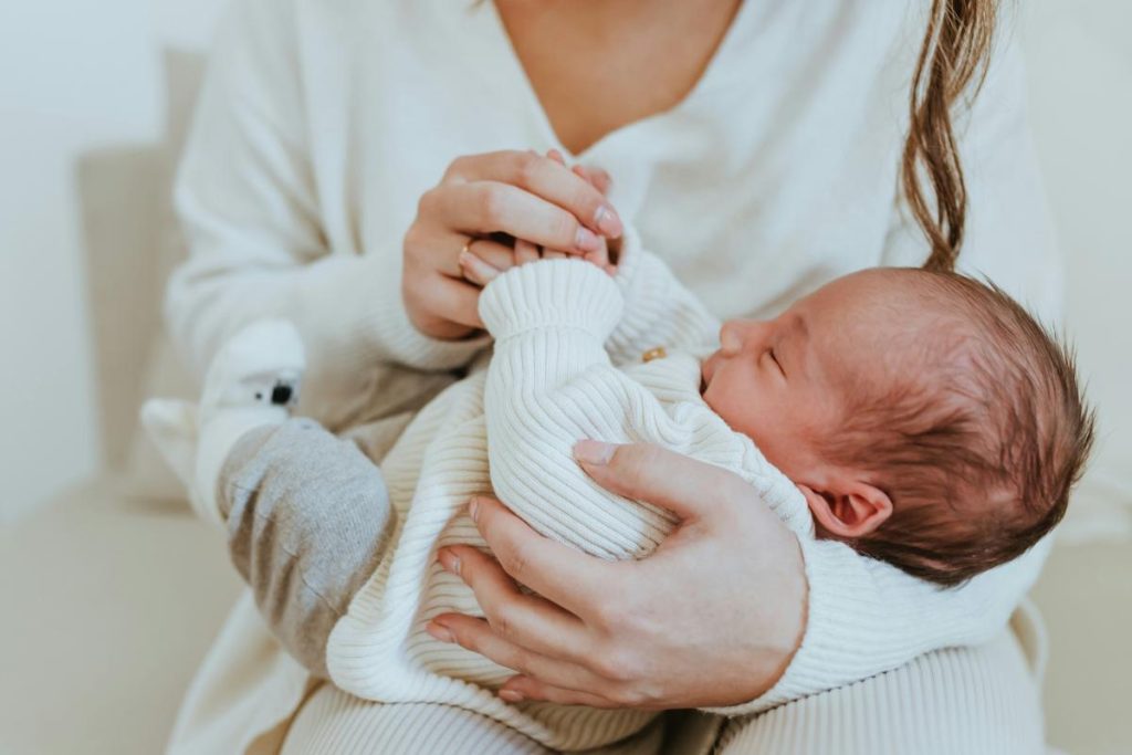 mother holding a baby in her arms