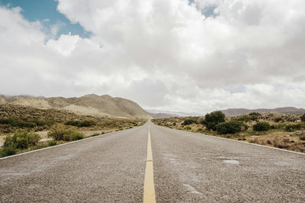 the open road stretching into the distance on a cloudy day