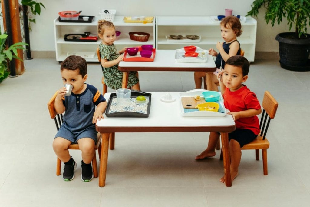 preschoolers sitting at tables