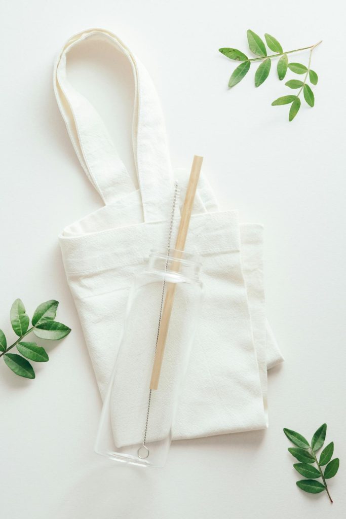 reusable bag and bottle with green leaves