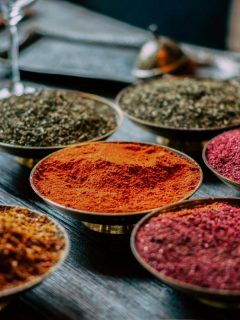 various spices in small bowls on a table