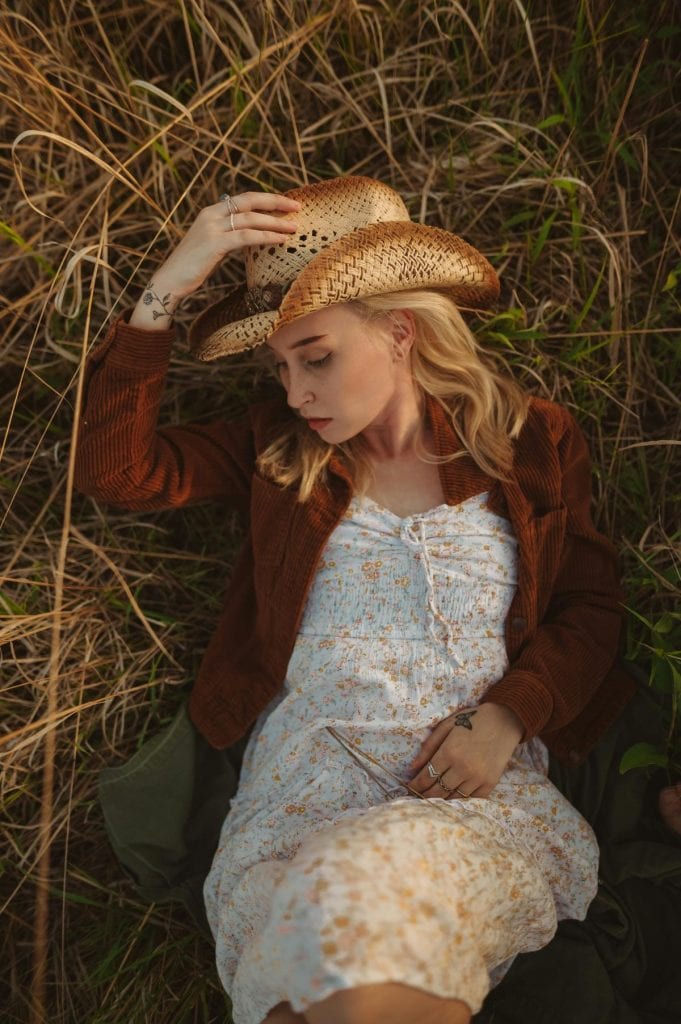 woman in dress and cowboy hat