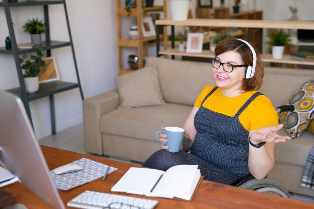 woman in wheelchair working remotely